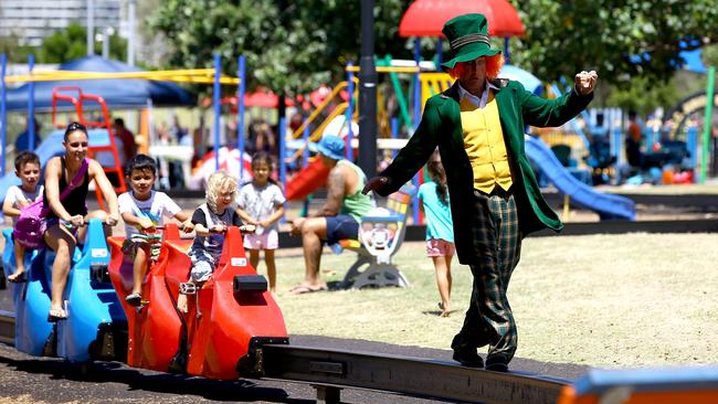 A children’s entertainer adds to the atmosphere as children play in the Broadwater Parklands. Picture: David Clark.