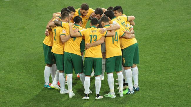 MELBOURNE, AUSTRALIA - JANUARY 09: The Socceroos form a team huddle prior to kick off during the 2015 Asian Cup match between the Australian Socceroos and Kuwait at AAMI Park on January 9, 2015 in Melbourne, Australia. (Photo by Scott Barbour/Getty Images)