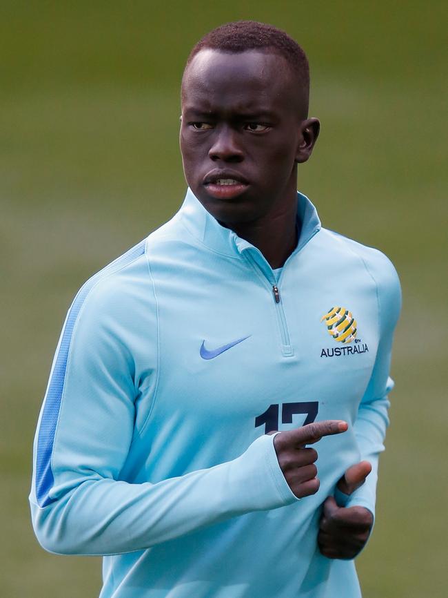 Awer Mabil warms up before a Socceroos training session in September. Picture: Darrian Traynor/Getty Images