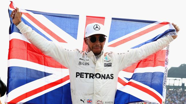 Hamilton celebrates after winning his fourth F1 World Drivers Championship at Mexico in 2017. Photo by Mark Thompson/Getty Images