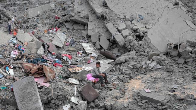 A boy sits among the rubble of his home in Deir el-Balah central Gaza. Picture: AFP