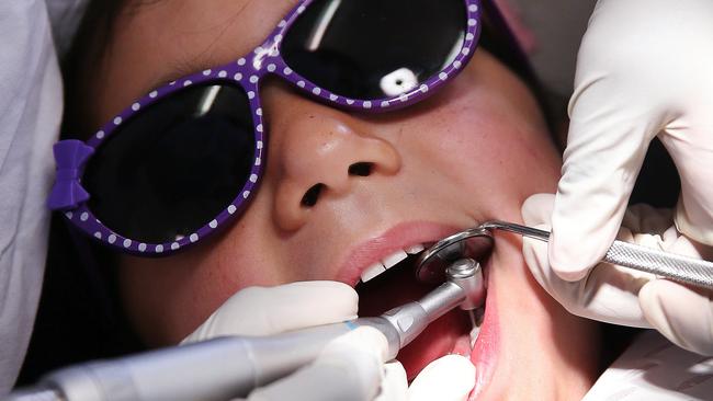 Royal Flying Doctors Service heads to Lightning Ridge in far west NSW to check the teeth of some local kids. RFDS Oral Health Therapist Prashiela Shandi pictured checking the teeth of Maleigha Jefferies at the Lightning Ridge Health Care Centre.