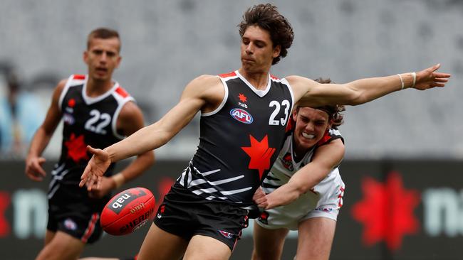 Forward James Borlase, kicking during the AFL grand final curtain raiser, is the son of 246-game Port Adelaide player Darryl Borlase. Picture: Darrian Traynor/AFL Photos/Getty Images