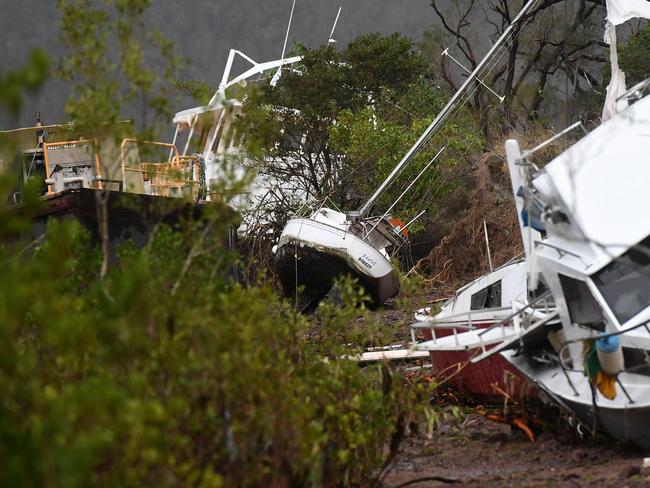 Boats are seen smashed against a bank at Shute Harbour, Airlie Beach, Wednesday, March 29, 2017. Cyclone Debbie has hit Queensland’s far north coast yesterday as a category 4 cyclone, causing wide spread damage. Picture: AAP Image/Dan Peled