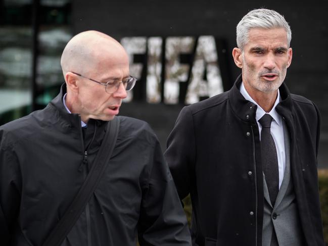 Former Australian football player Craig Foster (R) leaves the FIFA headquarters in Zurich next to Executive Director of the World Players Association Brendan Schwab (L) after handing over a petition to FIFA calling for Hakeem Al-Araibi to be freed on January 28, 2019 in Zurich. - Al-Araibi, a football player with refugee status has been detained in Thailand for nearly two months faces extradition over his alleged role in Bahrain's Arab Spring protests. (Photo by Fabrice COFFRINI / AFP)