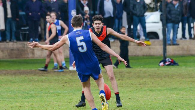 Riley Holder kicks a goal for Sacred Heart in its intercol win over Rostrevor. Picture: AAP/Brenton Edwards