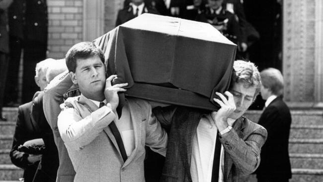 Pallbearers carry the casket of Colin Winchester in 1989.