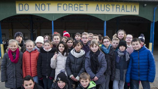 La Ecole Victoria (Victoria School) in the village of Villers-Bretonneux in France. In the courtyard a banner demanding Do Not Forget Australia. Picture: Ella Pellegrini