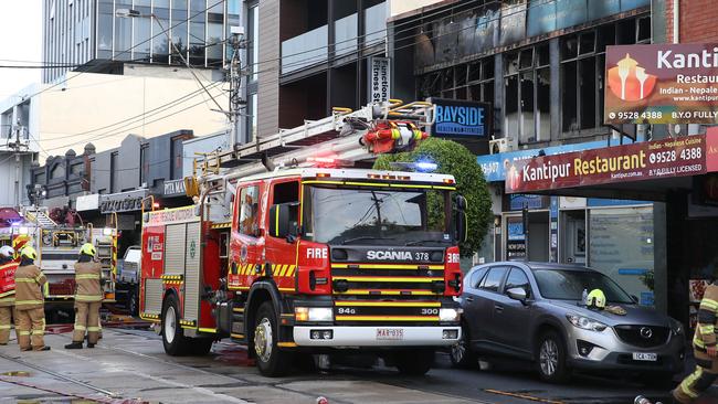 Fire crews outside the Caulfield North gym. Picture: Brendan Beckett