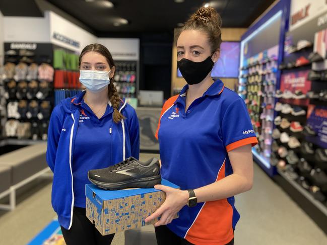 Martha Munn and The Athlete's Foot Dubbo manager Rebeka Farmilo are happy to be back at work after the Covid lockdown. Picture: Ryan Young