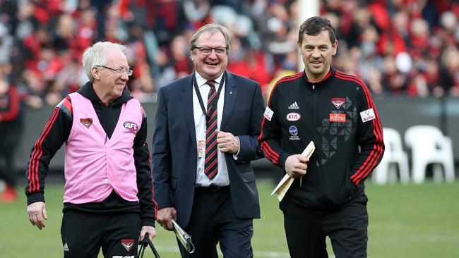 Bruce Reid, Kevin Sheedy and Mark Harvey share a laugh during a game at the MCG.