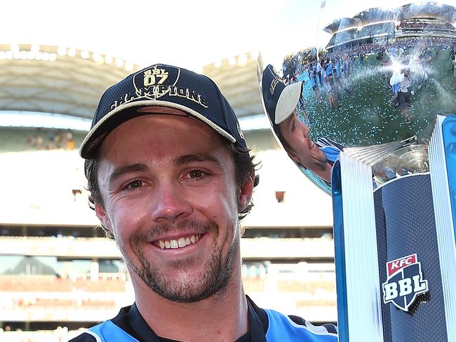 ADELAIDE, AUSTRALIA - FEBRUARY 04: Travis Head of the Strikers poses with the trophy after winningthe Big Bash League Final match between the Adelaide Strikers and the Hobart Hurricanes at Adelaide Oval on February 4, 2018 in Adelaide, Australia.  (Photo by Paul Kane/Getty Images)