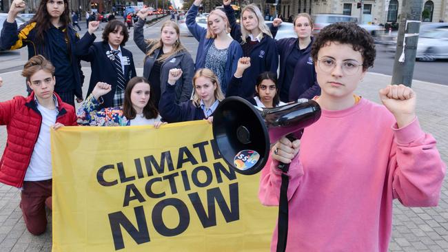 Audrey Mason-Hyde, right, prepares for the School Strike 4 Climate with fellow participants Tom, Rowan, Rosie, Anjali, Tabitha, Imogen, Maria, Grace, Charlotte and Alice in Victoria Square, Wednesday, May 19, 2021. Picture: Brenton Edwards