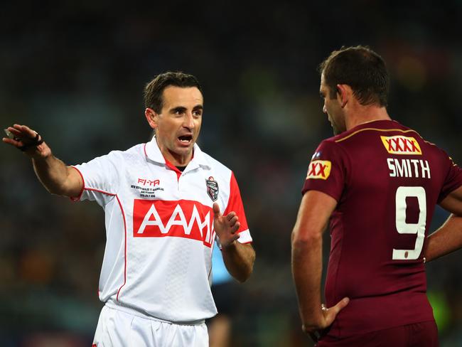 Referee Gerard Sutton speaks to Cameron Smith. Picture: Brett Costello