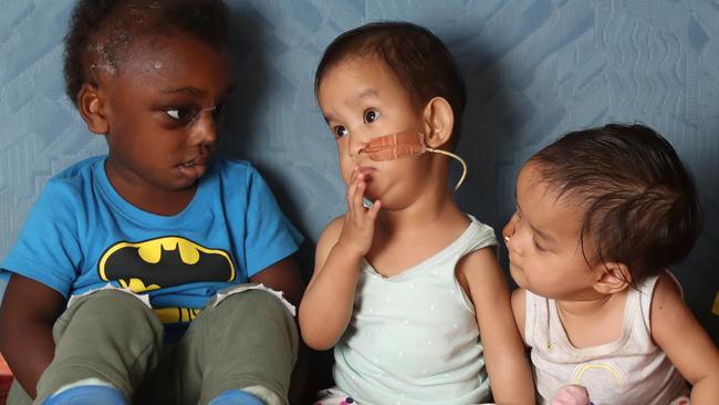 Jack Kalangis with formerly conjoined Bhutanese twins Dawa and Nima at Children First Foundation’s Kilmore retreat. Picture: Alex Coppel.