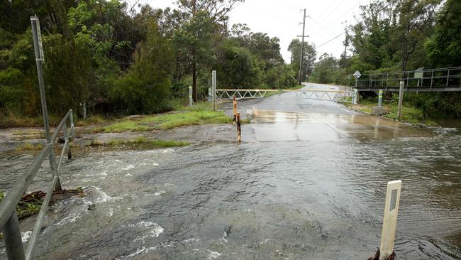 Oxford Falls Road in Oxford Falls is closed to Wakehurst Parkway due to heavy rain. Oxford Falls Road is often closed in heavy rain due to a creek always running over the road. Picture: NCA NewsWire / Damian Shaw