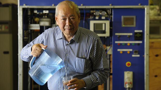 Rudy Gomez with a water purification plant at his workshop.