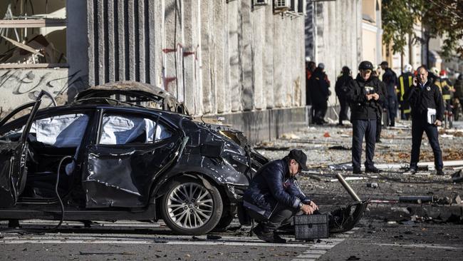 Emergency service personnel attend to the site of a blast on October 10, 2022 in Kyiv, Ukraine. Picture: Ed Ram/Getty Images