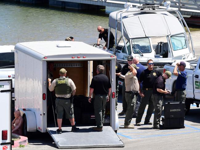 Law enforcement officials gather at the boating dock of Lake Piru to begin the search for missing Glee star, Naya Rivera. Picture: AFP