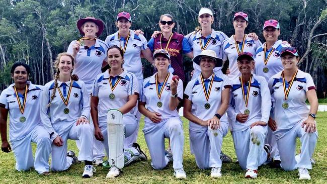 Coolum Women's cricket team celebrate winning the 2022/23 Division 1 grand final.