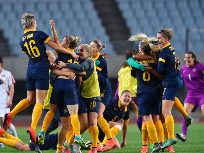 Australian Matildas players celebrate qualifying for the Rio de Janeiro Olympics. It will be the first time the Matildas have played at the Olympics since the Athens 2004 Olympics. Picture: Koki Nagahama/Getty Images