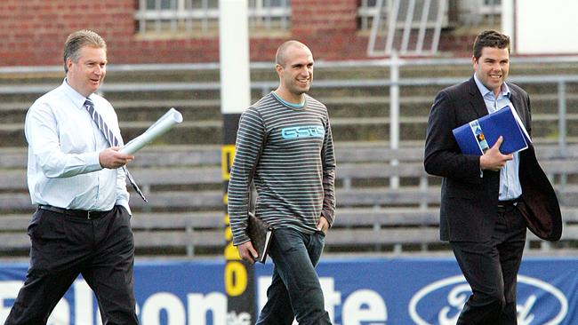 Swann shows Chris Judd and his manager Paul Connors around Princes Park in 2007.