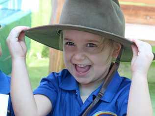 ALL SMILES: Emmerson is all smiles while creating a care pack for Australian soldiers at Rainbow Station in Casino. Picture: Lily Laughton-Cook