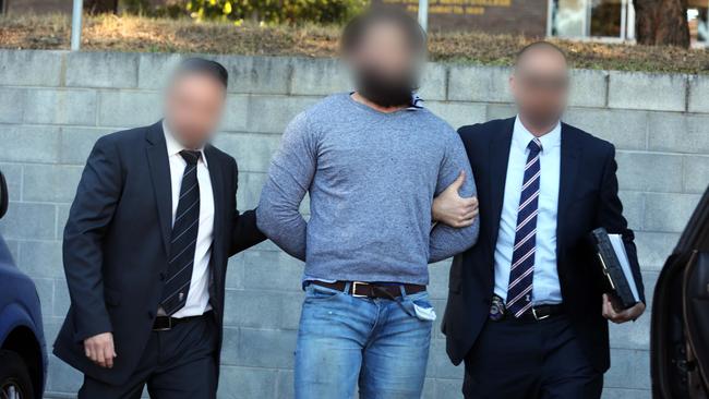 Detectives from the Joint Counter-Terrorism Taskforce arrest terror accused Tamim Khaja yesterday. Photo courtesy of NSW Police