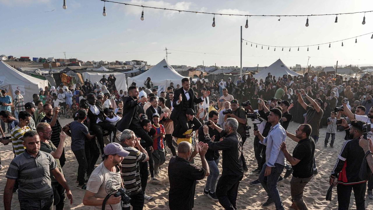 People attend a mass wedding ceremony in Khan Yunis, in the southern Gaza Strip. Picture: AFP