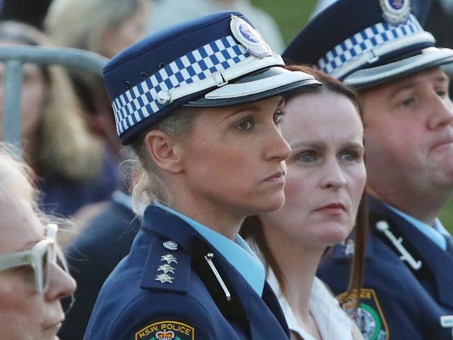 SYDNEY, AUSTRALIA - APRIL 21: Police officer Amy Scott (2L) arrives for a community candlelight vigil for the victims of the Bondi Junction tragedy at Dolphin Court at Bondi Beach on April 21, 2024 in Sydney, Australia. The Westfield Bondi Junction shopping centre was the scene of a frenzied stabbing attack on April 13, 2024 that killed seven, including the offender. The centre, which is an important feature of Sydney's affluent Eastern suburbs, re-opened for business on Friday. (Photo by Lisa Maree Williams/Getty Images)