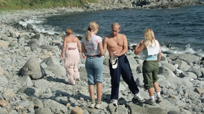 Putin and his family were shown in this 2002 photo that hid their identities. Picture: Supplied