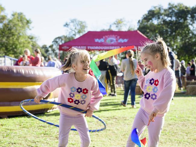 Madison (left) and Lexi Wilkinson at Sadie's Day Out, a special community event to celebrate the life of five-year-old crash victim Sadie, held at Cambooya State School, Saturday, June 7, 2025. Picture: Kevin Farmer
