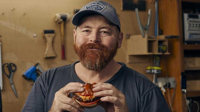 David Lindrea, an upholsterer from Cremorne, tries a Beyond Meat burger for the first time. Picture: Matt Harvey