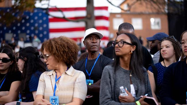 Actor Don Cheadle (C) and his wife Bridgid Coulter (C-L) wait with other supporters for Democratic presidential nominee, Vice President Kamala Harris to take the stage.