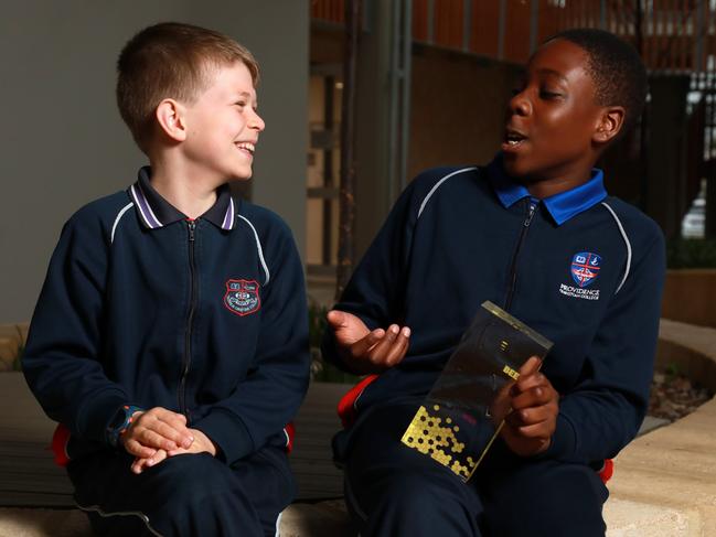 The 2023 Green level (Years 3-4) champion Samuel Wright, left, was a student at Providence Christian College student with the previous year's winner and 2023 runner up in the Orange category (Years 5-6): Ozi Egesi. with his 2022 Prime Minister's Spelling Bee trophy. Picture: Philip Gostelow