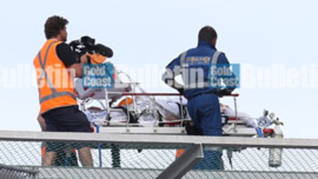 A 32-year-old man arrives at Gold Coast University Hospital after being mauled by a shark at Ballina this morning. Photo: Regi Varghese