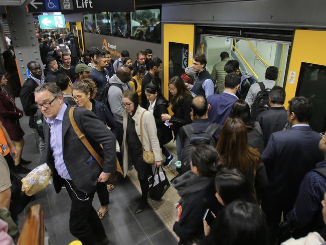 Commuters are seen during train delays at Town Hall Station in Sydney, Wednesday, September 25, 2019. Urgent signal repairs throughout the Sydney Trains network has commuters facing major delays. (AAP Image/Steven Saphore) NO ARCHIVING