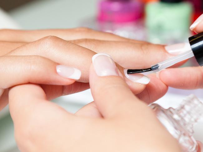 Woman having her manicure done