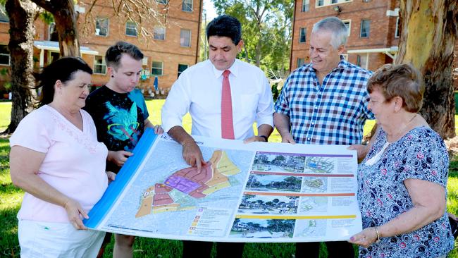 Community members Ronda Tucker, Richard Collis, Parramatta State MP Geoff Lee, Phil Ravesteyn and Christine Davis in Telopea, just before Christmas when the finalised master plan was released. (AAP IMAGE/ Angelo Velardo)