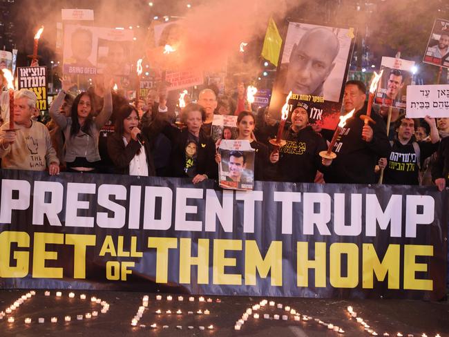 Relatives and supporters of Israeli hostages held in the Gaza Strip since the October 7, 2023 attacks by Hamas militants, gather in favour of the Gaza truce in front of the Israeli defence ministry in Tel Aviv on January 16, 2025. The United States said on January 16 it was "confident" that a fragile Gaza ceasefire and hostage release deal would take effect on time, even as Israel carried out new air strikes ahead of a cabinet vote on the accord. (Photo by Jack GUEZ / AFP)