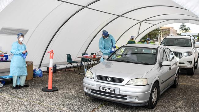 Health workers operating coronavirus tests at the drive-through testing clinic at Bondi Beach. Picture: Flavio Brancaleone