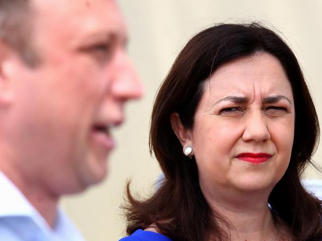 BRISBANE, AUSTRALIA - OCTOBER 12: Queensland Premier Annastacia Palaszczuk (R) looks on as Deputy Premier Steven Miles speaks at a press conference at an ambulance station on Bribie Island on October 12, 2020 north of Brisbane, Australia. The Queensland state election will be held on 31 October 2020. (Photo by Jono Searle/Getty Images)