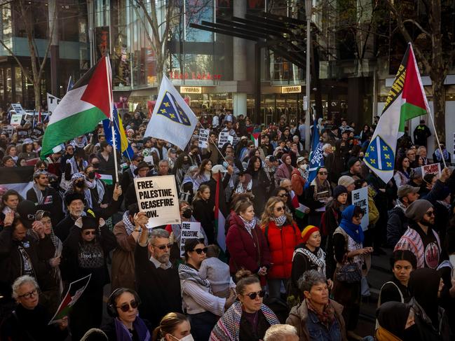 MELBOURNE, AUSTRALIA - NewsWire Photos - 23 JUN, 2024:  Pro-Palestinian supporters march along Swanston St in Melbourne to call for peace and an end to the current Israeli occupation of Palestine and the ongoing war between Palestine and Israel, as Israel pushes further into the Gaza strip.. Picture: NewsWire / Tamati Smith