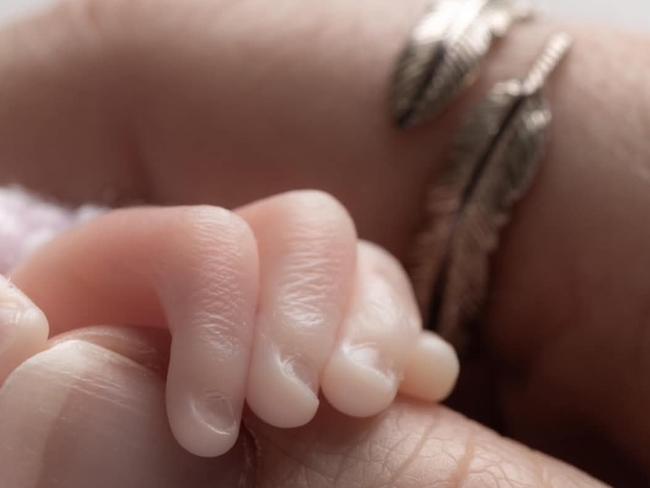 Isla Mae Bailey's little hand.