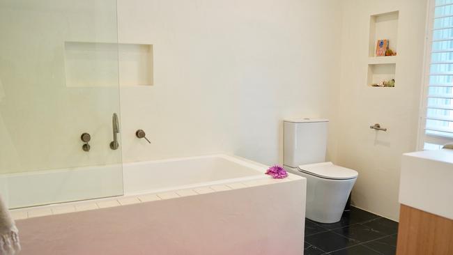 AFTER: A bathtub and recessed shelves were installed. Picture: Katrina Lezaic