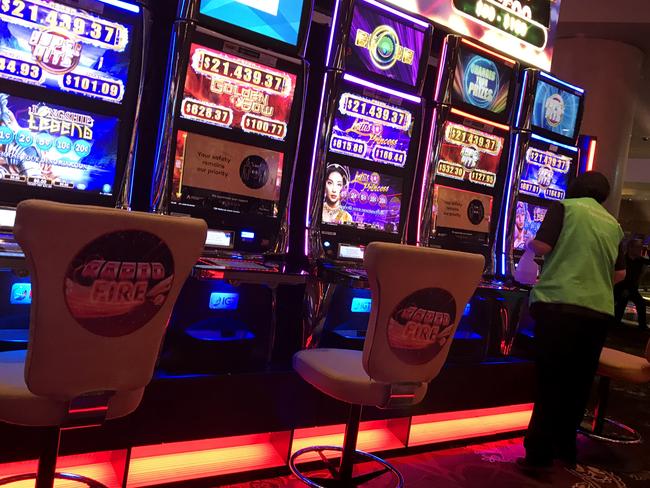 A case of COVID-19 has been traced to The Star casino in Pyrmont after a patron visited on Saturday 4th July. Health authorities are racing to contain clusters that threaten to break through containment measures. A cleaner sanitizes pokie machines. Picture: Supplied