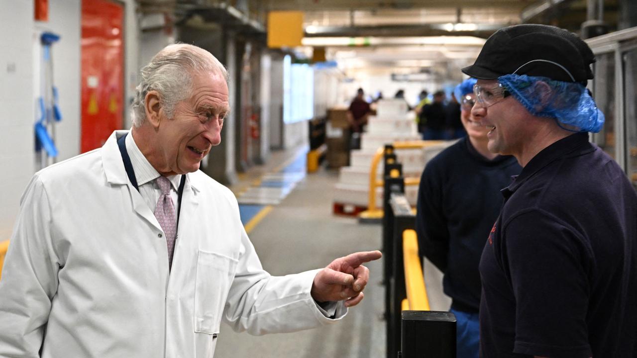 Britain's King Charles III meets the cornflakes production line. Picture: AFP