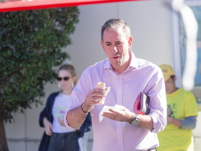 Treasurer Jim Chalmbers made sure he had something to eat before voting at Springwood Road State School in his electorate of Rankin. Picture: NewsWire / Glenn Campbell