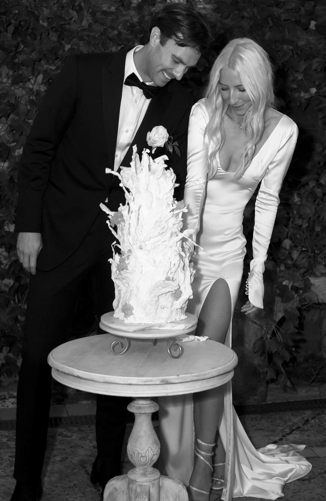 Natasha Chipman and Keiran Ruddock cut their wedding cake. Picture: Bayleigh Vedelago