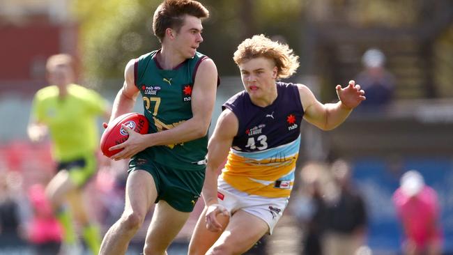 Oskar Smartt gives chase. (Photo by Kelly Defina/AFL Photos/via Getty Images)